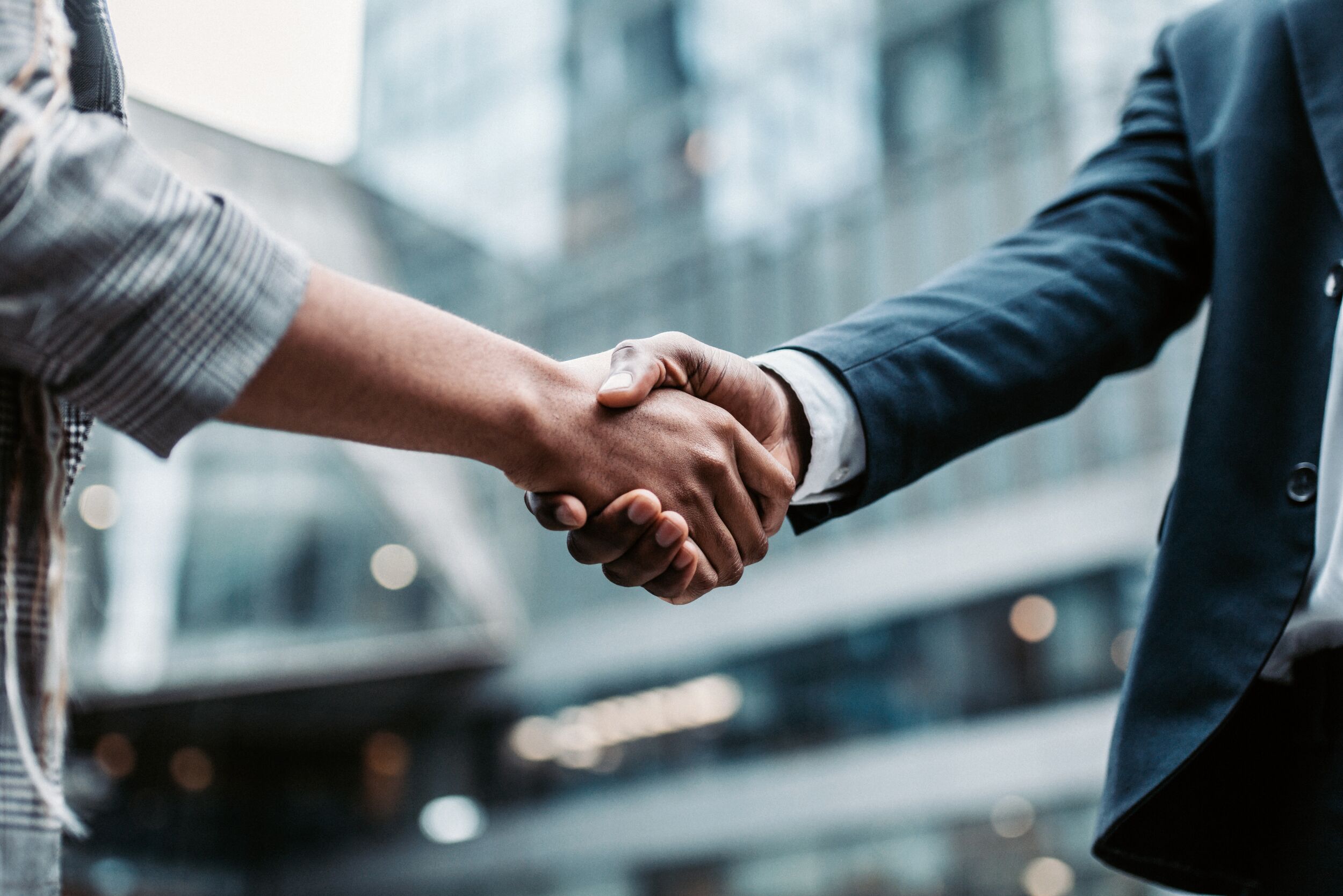 Two business people shaking hands.